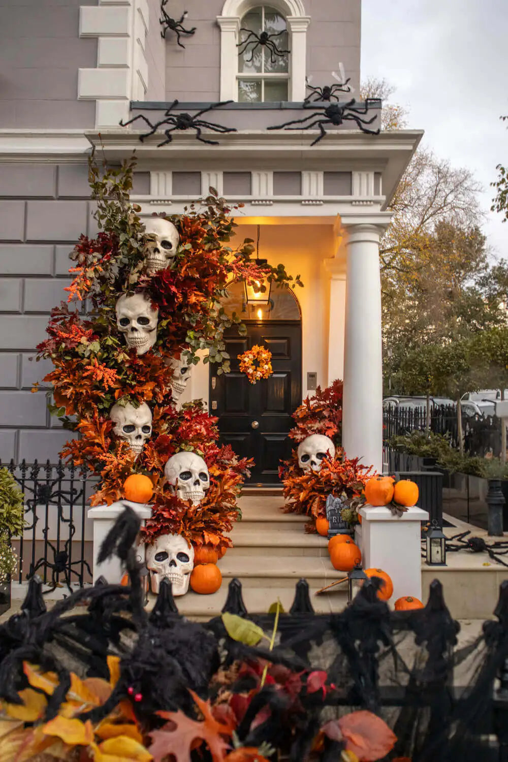 A gorgeous display of Halloween Photos and die giant skulls and spiders on a Notting Hill building